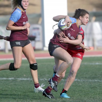 UQ-player-Marioulla-Belessis-is-tackled-as-she-runs-the-ball-forward